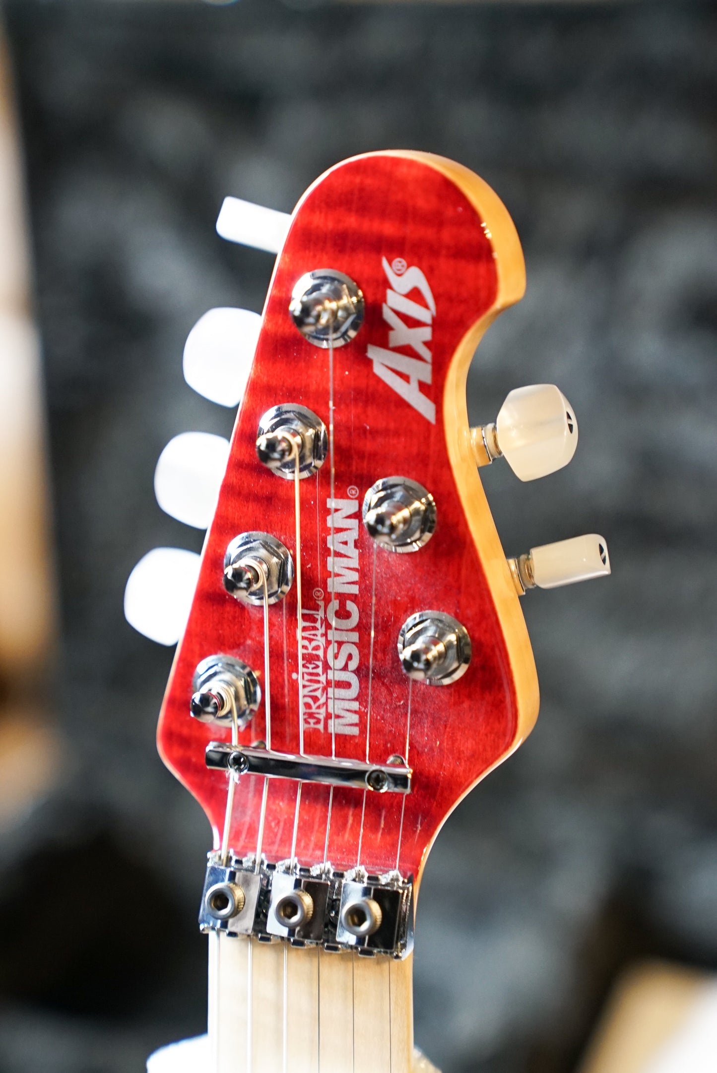 Music Man 30th Anniversary Axis - Translucent Red Quilt Top/Black Red Sparkle Back - Figured Maple Neck/Matching Headstock